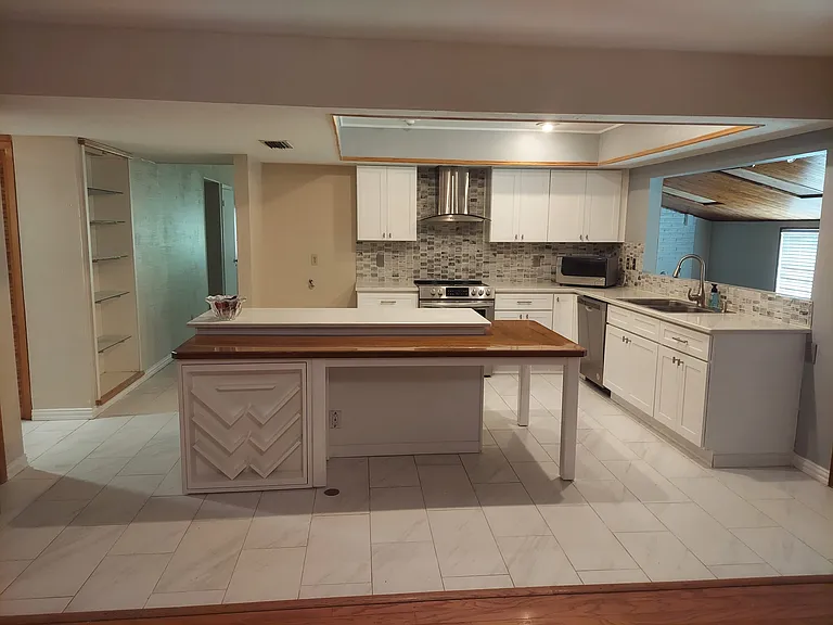 kitchen and eating area, with wine rack