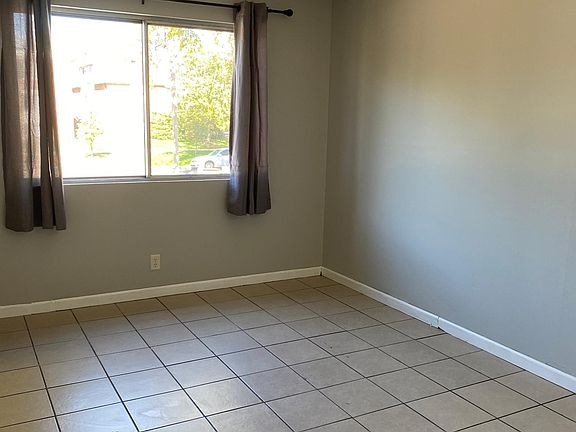 Living room. Spectrum cable connection is near the NW corner.