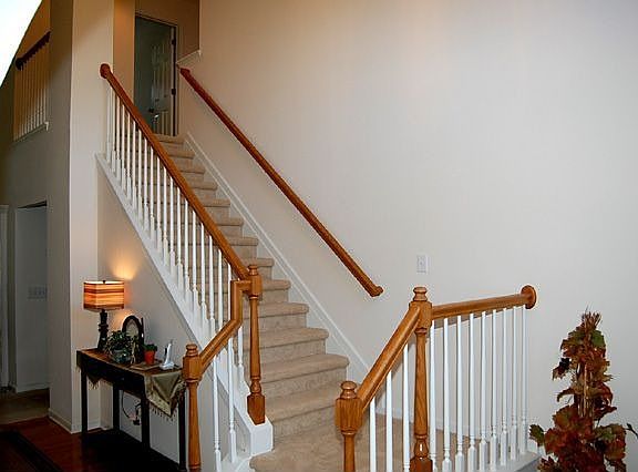 Entrance Foyer w/ Hardwood Floor & Terraced Stairs