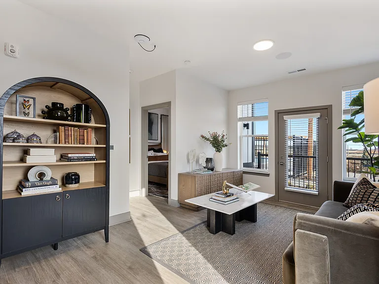 Model apartment living room with open layout at Montage West Lafayette.