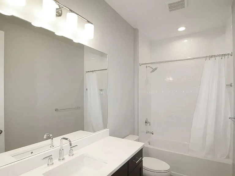 2nd Bathroom features Quartz Counter & ceramic tile surround to the ceiling