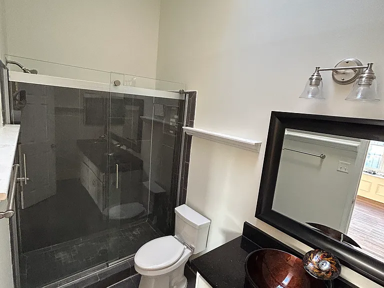 standing shower inside the main bedroom