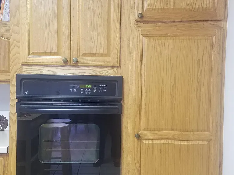 Wall oven and cupboards with pull out drawers