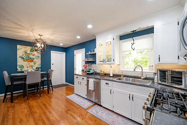 Gas Range, Recessed Lighting, Kitchen Aid Dishwasher, Kitchen Aid Mixer, VitaMix, Bar Height Table and Chairs, Lighted Cabinets