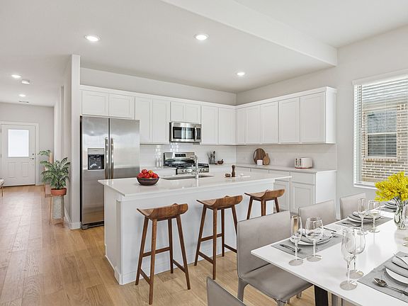 Kitchen in the Stanley II home plan by Trophy Signature Homes - REPRESENTATIVE PHOTO