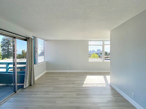 BRIGHT LIVING ROOM - WINDOWS THROUGHOUT