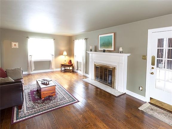 Door to the right of fireplace leads to a private covered patio with new awnings.