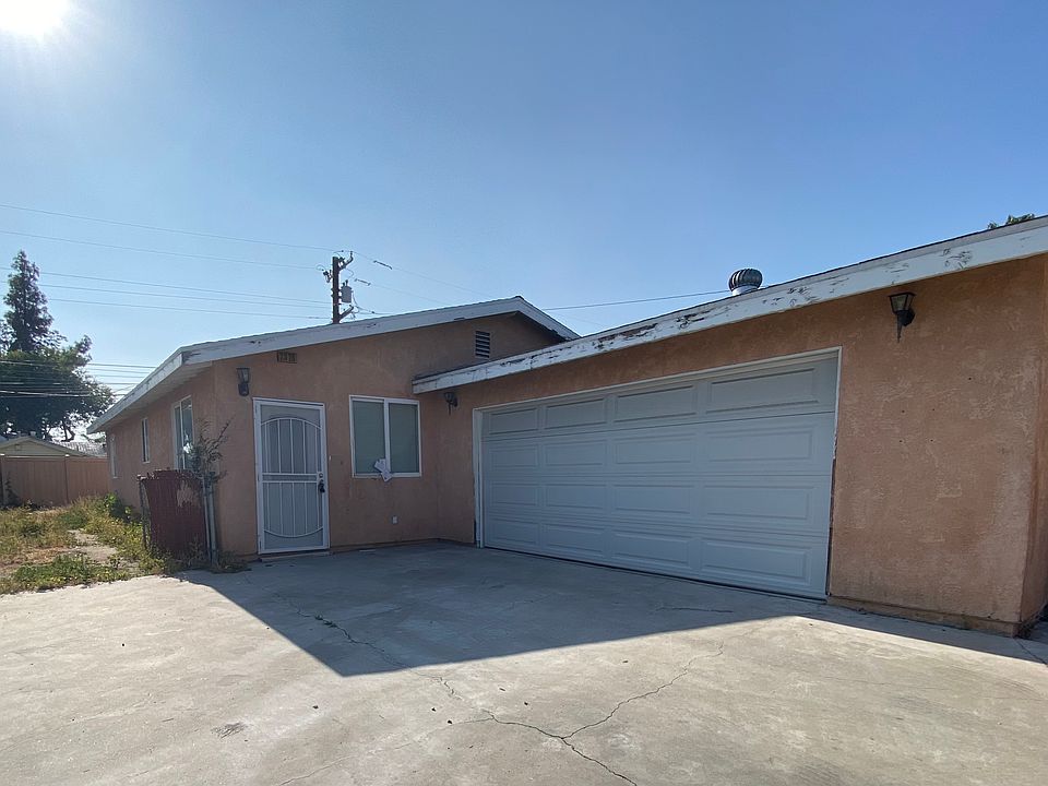 Exterior with driveway and 2 car garage