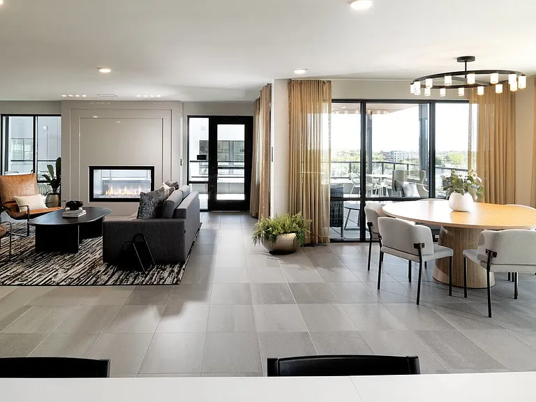 Rooftop resident lounge with kitchenette, fireplace, and ample lounge seating