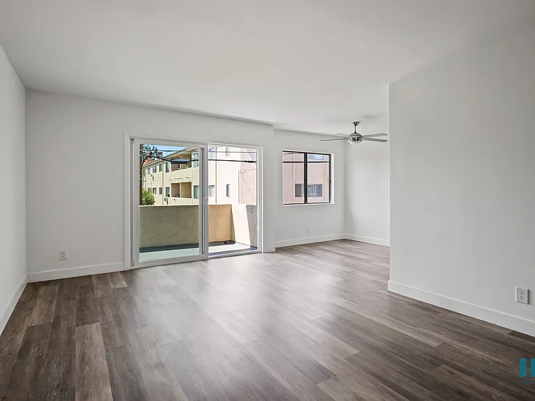 Open-Concept Dining and Living Room with Patio