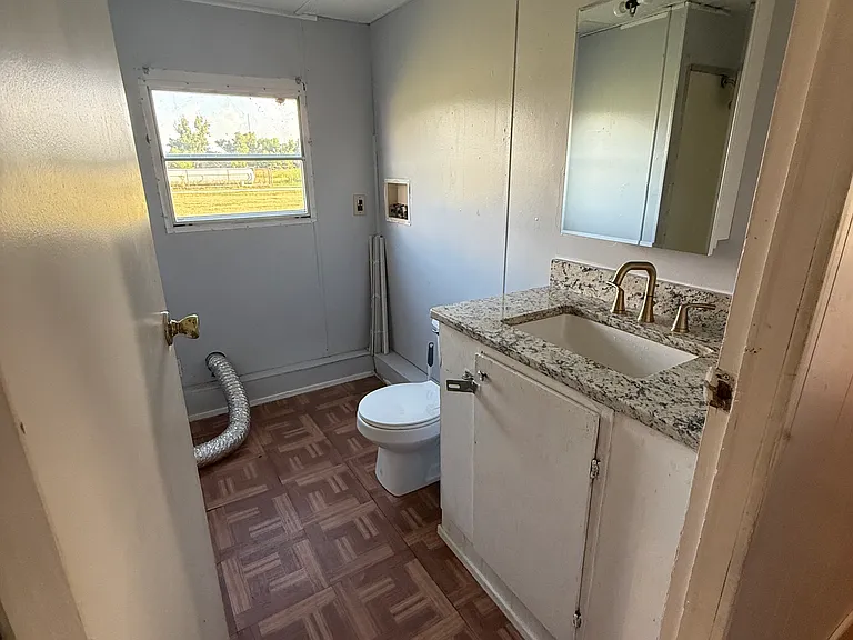 Bathroom. Updated granite and bathroom fixture. Washer and Dryer hookups.