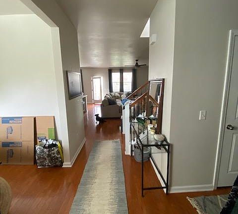 Entrance Way - to the left is dining room, to the right is 1/2 bath , laundry, and garage entrance. Enjoy afternoon sunlight coming in through the storm door attached to the front door.