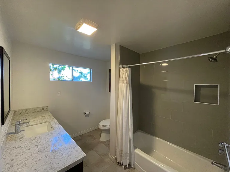 Bathroom 1 with Shower/tub, 6ft of countertop space, and tons of natural light!