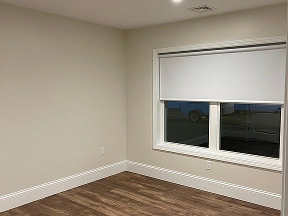 Large bedroom with lots of natural light during the daytime hours.