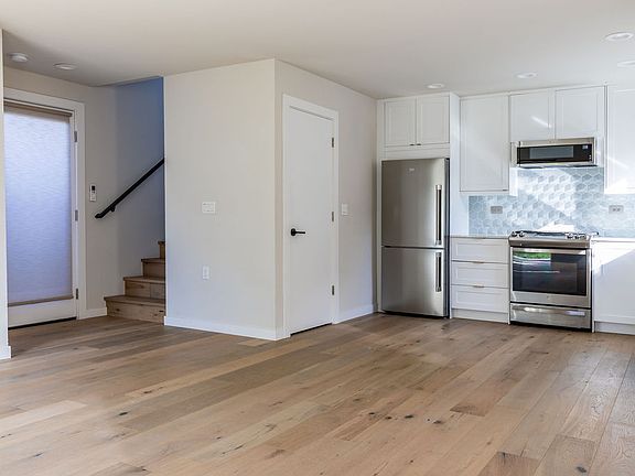 Airy open-concept living, dining, and kitchen