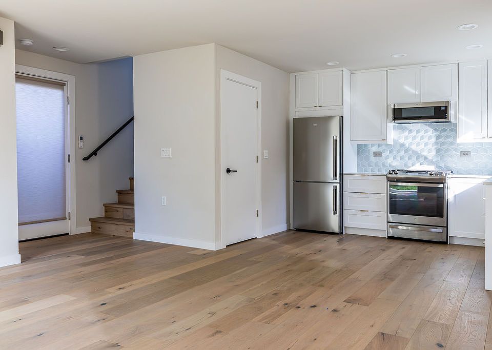 Airy open-concept living, dining, and kitchen