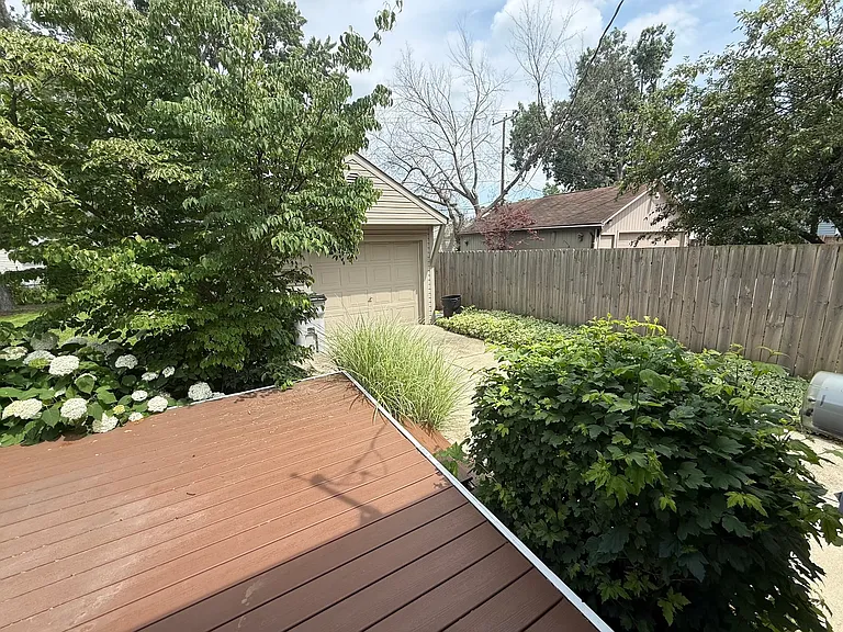 Deck with privacy fence, view of garage