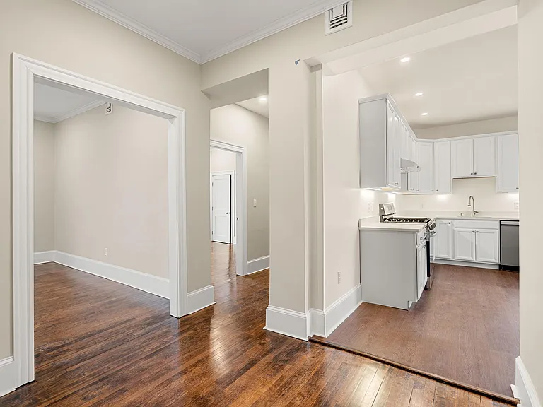 View from foyer - looking into living room, kitchen and down hallway