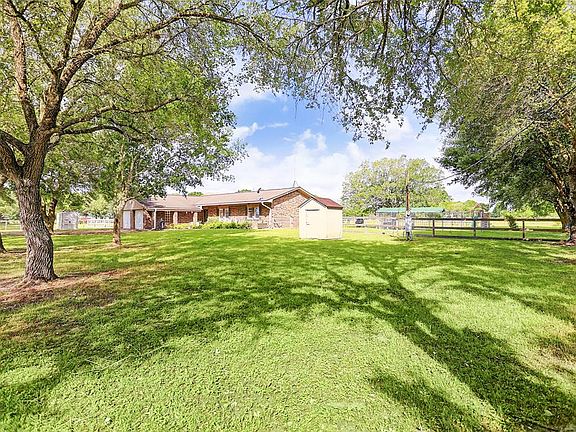 Beautiful Oak trees throughout the property.