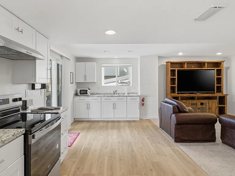 Open living area with full kitchen