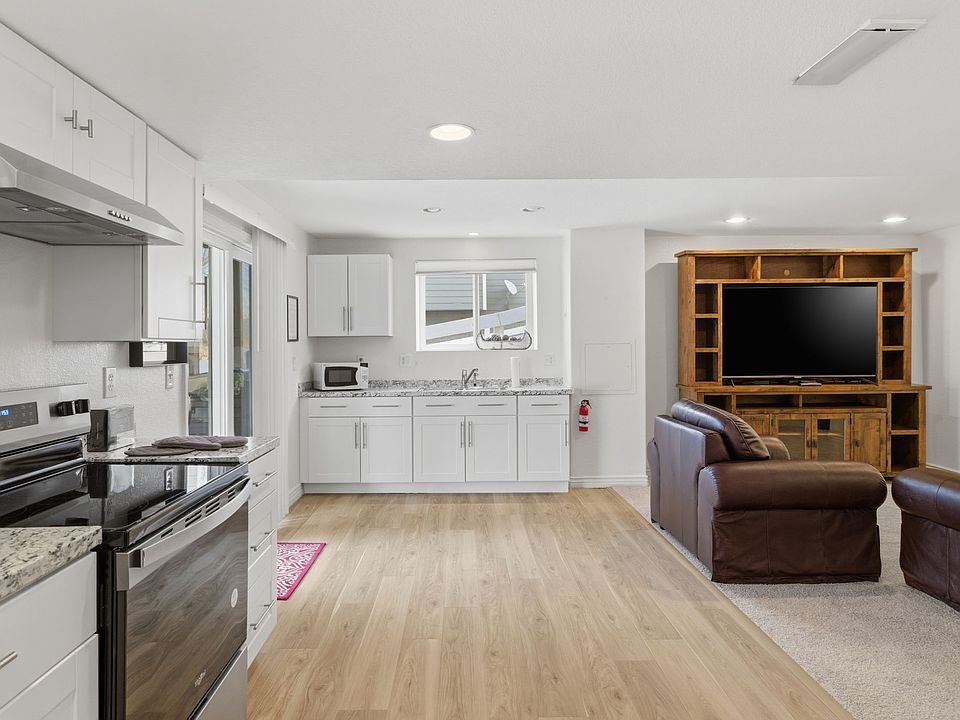 Open living area with full kitchen