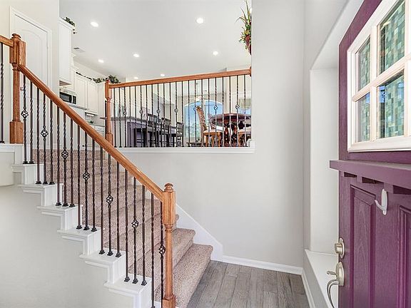 A sneak peek at the staircase that leads to the second level main living spaces! Let's take a trip downstairs to the first level of this townhome.