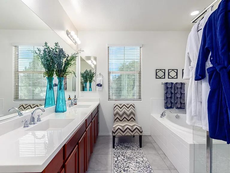 High vanity with plenty of storage. Custom banks of drawers on each side.