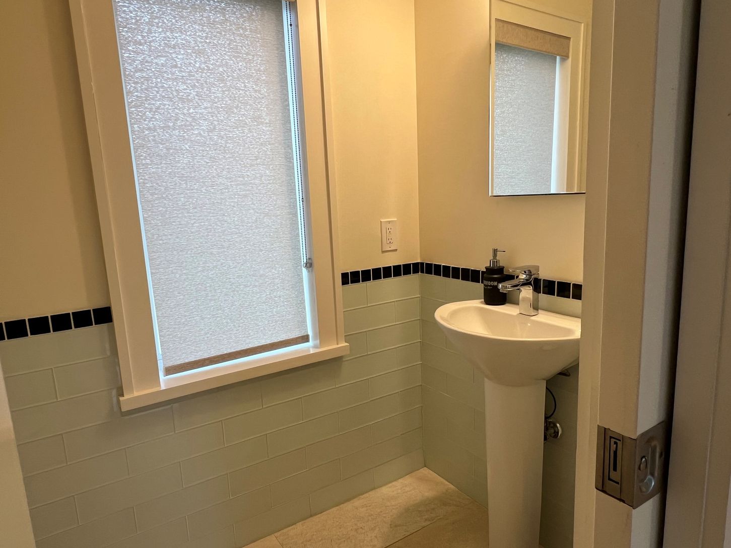 powder room off kitchen and dining area.