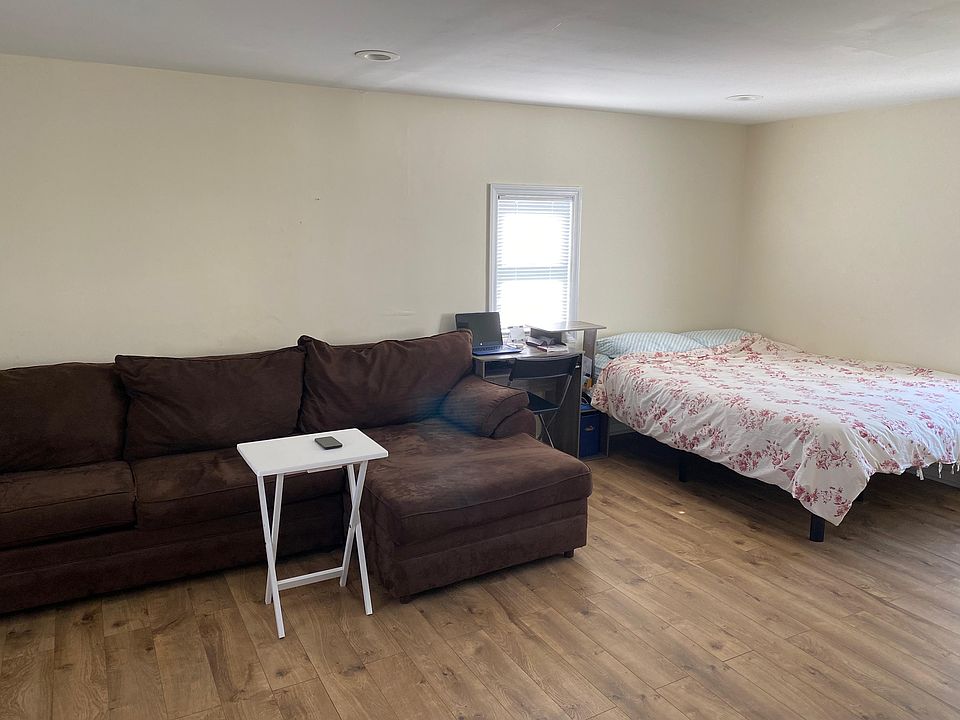 Working Table and Chair between bed and Couch