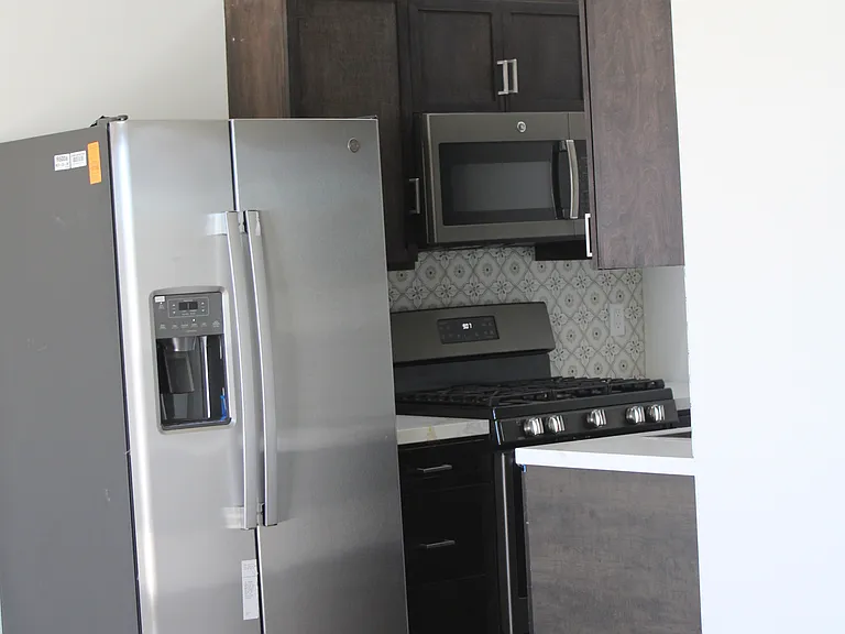 new stainless steel appliances, gas stove, microwave, refrigerator