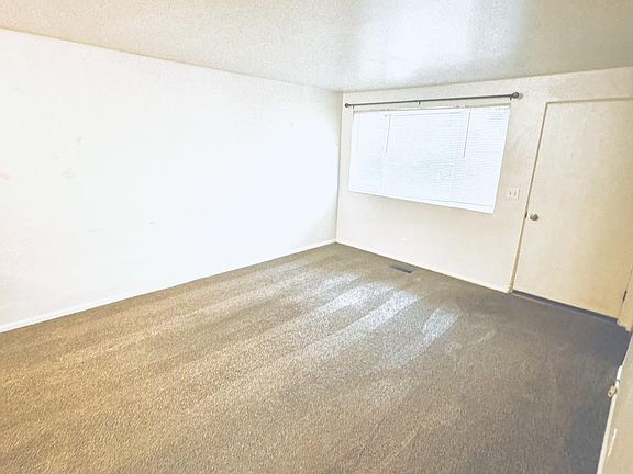 Living Room with Front Door from Kitchen