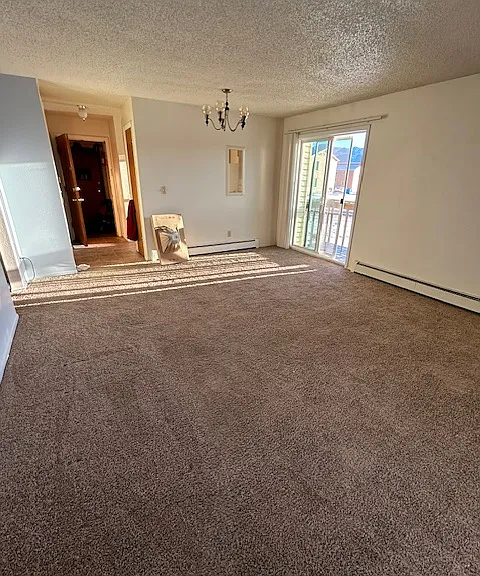 Living Room has Slider Door with Deck Balcony...