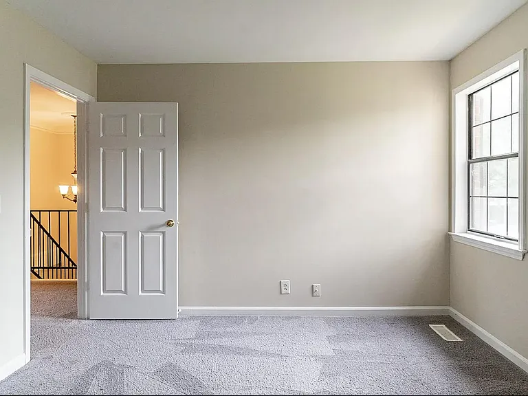 Please note that the carpet has been removed and replaced with hardwood floors.