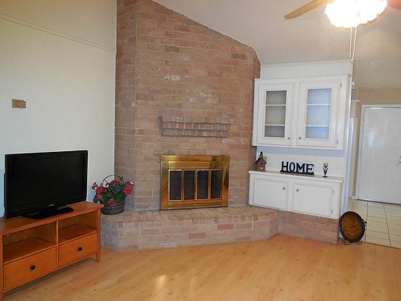 Fireside cheer in light & bright den.