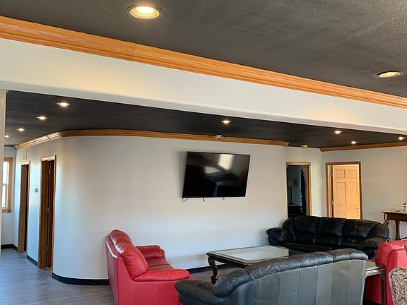 Living room upstairs. TVs are included. 3 total.