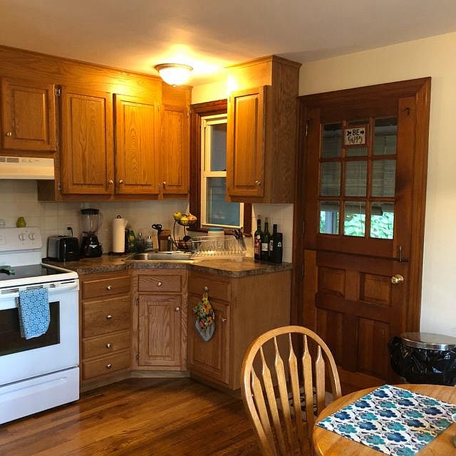 Kitchen with exterior door to porch.