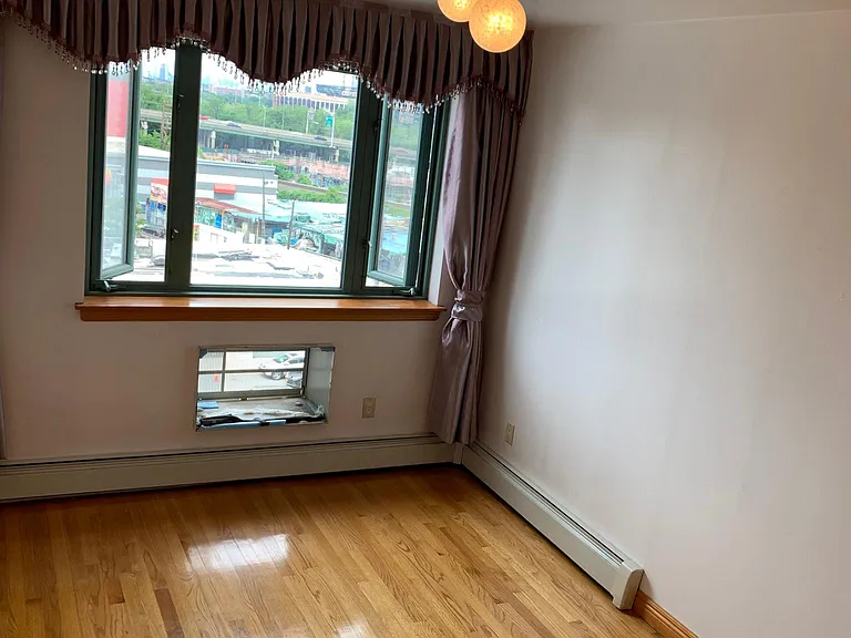 Large window with two openings in bedroom one