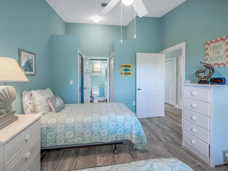 Guest bedroom with attached bathroom, also accessible from the main hallway.