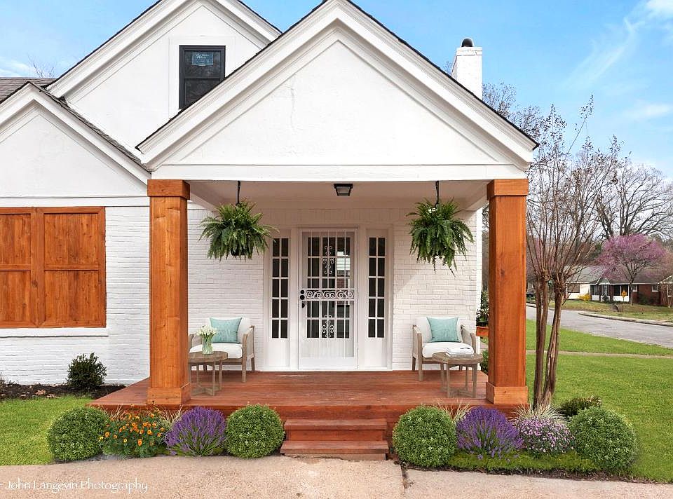 Front Door: Brand new cedar front porch with matching cedar feature wall that adds to the eye-catching design of this modern farmhouse.