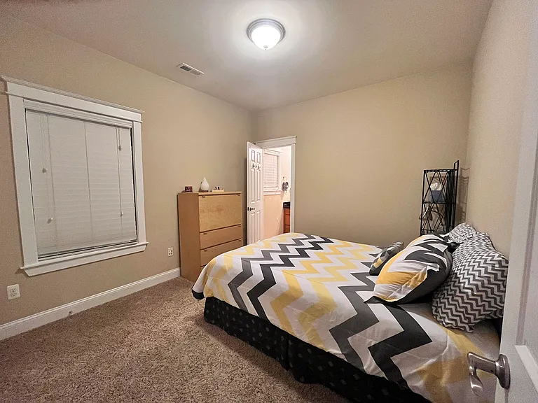 Bedroom 3 with private ensuite bathroom.
