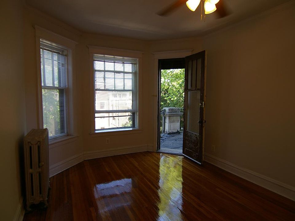 Living room looking West, front porch door open.