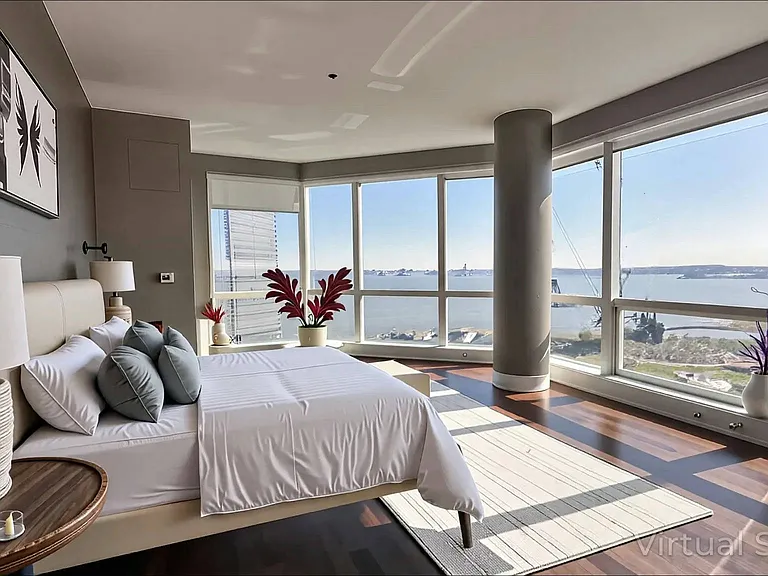 Master Bedroom with view of Manhattan, Hudson River and Statue of Liberty