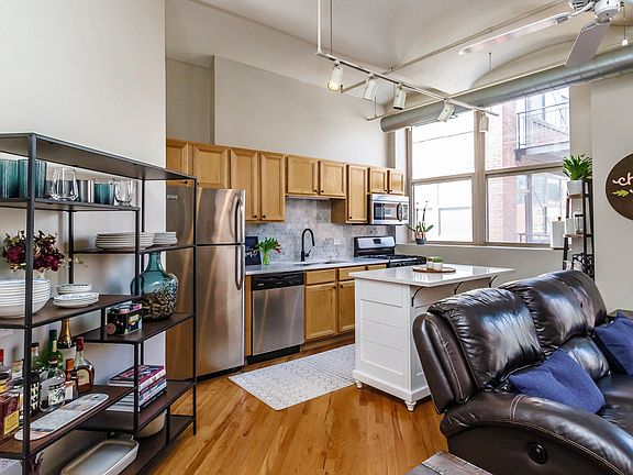 Large windows and high ceilings make this unit lig