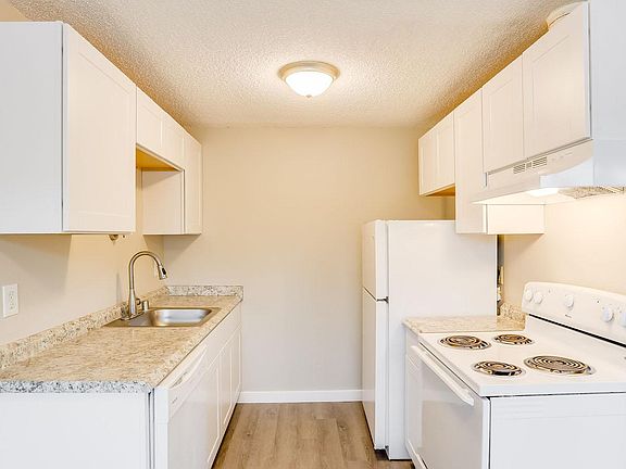 Shaker style cabinets, new countertops and updated faucets