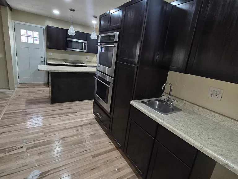 Full size convection double ovens and island with outlets