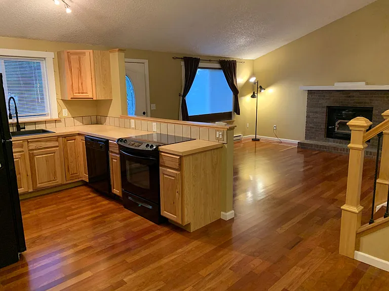 Open concept with great room, Brazilian cherry hardwood floors, wood burning fireplace insert to heat the house in winter, insulated custom window shades