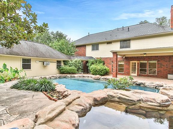 This backyard offers a private oasis with both pool and spa.