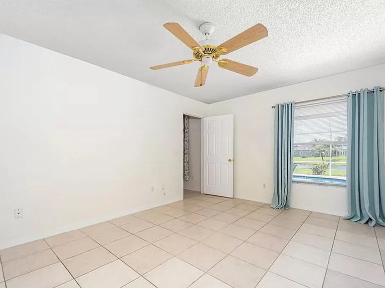 master bedroom, view of the pool and lake