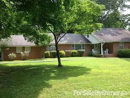 Large Level Yard
						:
						One acre lot with mature trees in the heart of Johnson City.