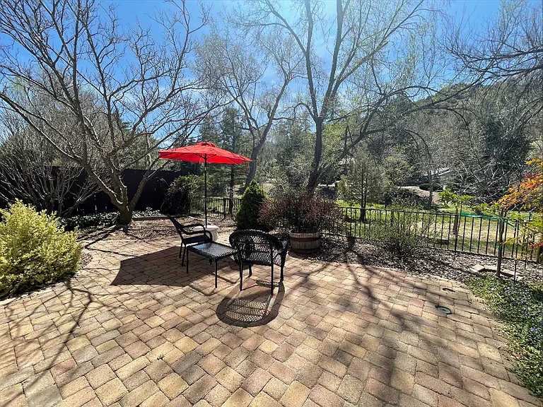 Large enclosed patio opening up to tranquil views, and endless trails.